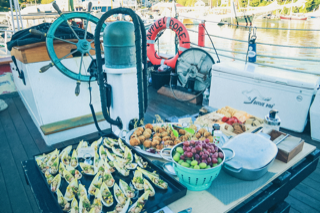 Hors d’oeuvres included Sweet Corn Shrimp Endive Cups, Pancetta and Scallion Potato Croquettes rom 16 Bayview, grapes, a cheese platter and other delicious contributions throughout the schooner