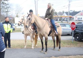 Belfast Police Chief Bobby Cormier stands left with two Horses Over America volunteers.
(photo by Erica Thoms)
