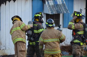Lincolnville firefighters entered the building with hoses, along with Camden and Rockport firefighters. (Photo by Lynda Clancy)
