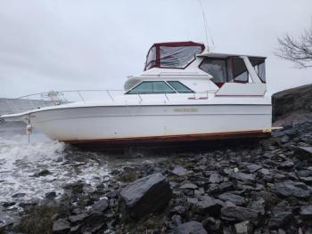 This boat washed up on an Owls Head beach during the Dec. 15 storm, the third or fourth boat in three years to break free of a mooring and get stranded on this particular beach. Boats, many fiberglass, get pummeled by harsh conditions, and if not salvaged quickly, they leave remnants on the beach and in the water. (Photo by William Garver)