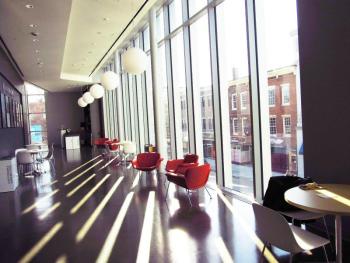 The second floor of the Art Center with generous light and seating opposite the new space for the Maine Film Center. Photo by Kay Stephens