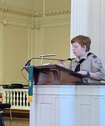 Camden: Gavin Moore, a member of the Butter Patrol in Troop 200, read from the Gospel of Luke “The Parable of the Good Samaritan” during Scout Sunday observance on February 12 at First Congregational Church of Camden, United Church of Christ. (Photo courtesy Chuck Mahaleris)
