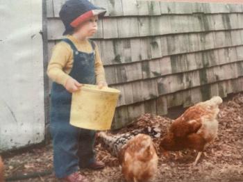 Little Bill O’Brien feeds the chicken, circa 1975. (Photo courtesy of Diane O’Brien) Chickens