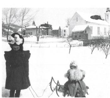 An old photo of the school house next to the grange. (Photo courtesy Long Funeral Home)