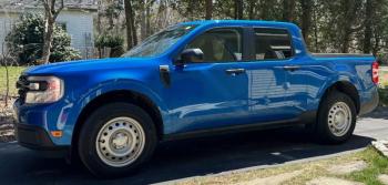 The Maverick XL is a midsize, front-wheel-drive hybrid pickup that is refreshingly focused on utilitarian truck-ness. Note no break between the cab and the bed: This is a unibody chassis shared with the also excellent Ford Bronco Sport.