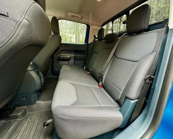 The rear of the crew cab is a bench seat with three sets of safety belts and storage underneath.