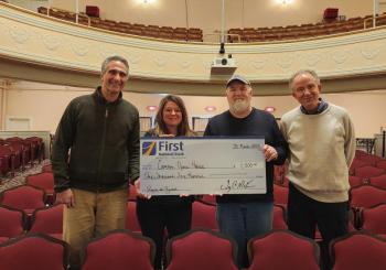 Celebrating their Jazz in June donation are, from left, Gary Stone, Senior Portfolio Manager and Senior Business Development Officer for First National Wealth Management; Necole D. Janczura, Business Development Officer for First National Bank and First National Wealth Management; Jazz in June founder/director Matt Brown; and Camden Opera House Manager Dave Morrison. (Photo by Dagney C. Ernest)