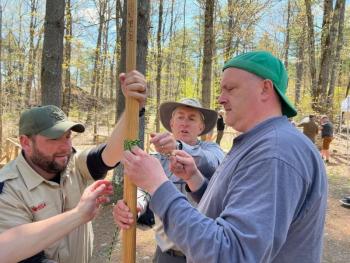 Rope Work: Adam Wright of Lewiston, Doug Woodbury of Rockport, and Jon Martin of Augusta demonstrate round lashings. They learn the skill so that they can then instruct their Scouts on the skill. (Photo courtesy Chuck Mahaleris)