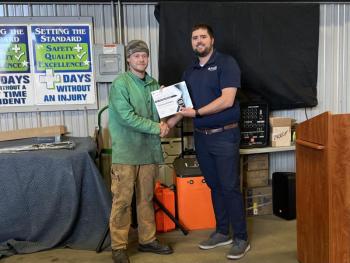 Thomas Bradley receives scholarship certificate from Thomas Kennedy II. (Photo courtesy Steel-Pro Incorporated)