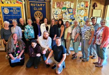 Joining Belfast Rotary Club president Kristine Wentworth (back row in white jacket) and treasurer Beth Sterner (front row, left) on June 21, are volunteers and staff from food programs receiving $15,500 in Rotary Club donations. They include Cherie Merrill and Mary Brand from Belfast Soup Kitchen, Jon Karr from Greater Bay Area Ministerium Food Cupboard, Sue Crane and Andrea Maloney from Jackson Food Pantry, Mary Guindon and Tanya McGray from No Greater Love Food Pantry, Irene Blood and Patti Wright from Northport Food Pantry, Ralph Harvey from Searsport Congregational Methodist Church Food Panty Center, Donna Kelley from Waldo Community Action Partners, Bonnie Kein from Waldo County Technical Center, and Vincent Hugh Saggese, Damian Whitmore, Rapheal Gray and Rio Greeley from the Game Loft. Little River Baptist Church Food Pantry also received a donation. (Photo courtesy Belfast Rotary Club)