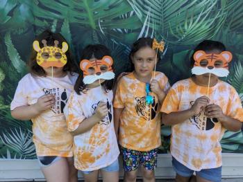 Zoey Hendron, Gemma Rubino, Aubree Joynt, and Elizabeth Guzman pose in the photo booth. (Photo courtesy Thomaston Grammar School)