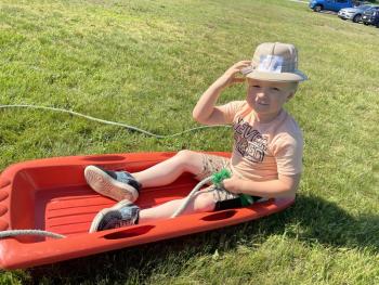 Azrael Dare “rows” his “boat” uphill. (Photo courtesy Thomaston Grammar School)
