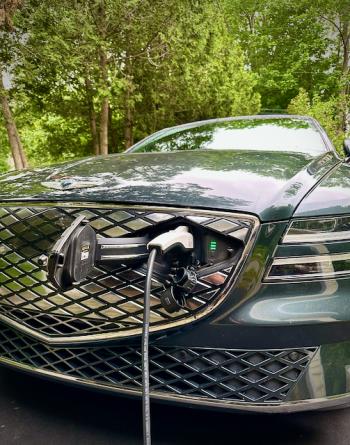 Who says a charge port has to be where the gas filler was? Genesis is the first EV we’ve seen that sensibly puts it in the grille, which no longer has to let air flow over the engine. (What engine?) This is the household-current charging cord that comes with the vehicle, not the heavy-duty cable from the Level II fast charger.