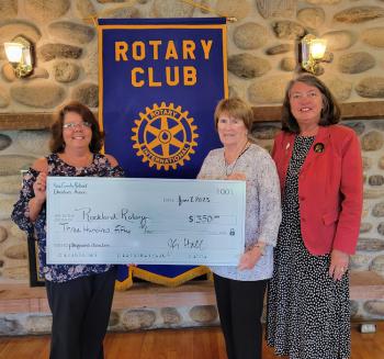 Rockland Rotary President Tena Wallace (L) receives a check from Joan Hall and Beth Chamberlin of the Knox County Retired Educator's Association (KCREA). (Photo by Ferolyn Curtis)