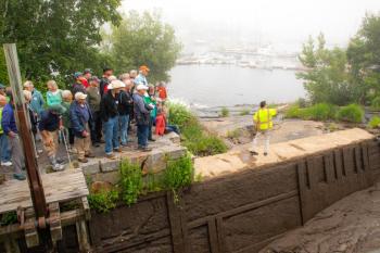 Camden Public Works Director Dave St. Laurent talks with the 70 citizens who toured the Megunticook River and its dams June 27 as part of an ongoing educational effort of the watershed hosted by the municipal Megunticook River Citizens Advisory Committee. (Photo courtesy Lauren Caffe/FB Environmental Associates)