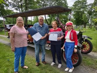 From left: Sonja Sleeper, Lady Knox Chapter DAR member, Warren Kincaid, Ground Vehicle Conservator at the Owls Head Transportation Museum, accepting his certificate of appreciation, Joanne Richards, Regent of Lady Knox Chapter DAR, and Joyce Davies, Vice Regent of Lady Knox Chapter DAR. Kincaid also accepted the certificate of appreciation on behalf of the museum. (Photo courtesy Mary Kelly)