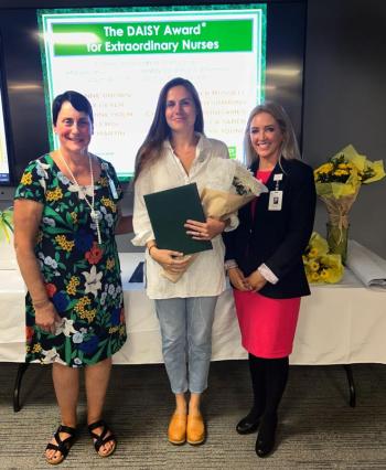 DAISY Award winner Katherine Holm, RN, Emergency Department nurse, stands with PBMC and WCGH Chief Nursing Officer Ellen Leone, RN, left, and PBMC and WCGH President Denise Needham, PharmD, after receiving her award during the DAISY and Sunshine Awards ceremony on Monday, Aug. 21, at PBMC. (Photo courtesy Pen Bay Medical Center)