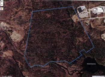 The parcel of 100 acres on which a 48-lot housing development is planned.