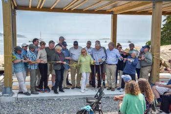 Maine Congresswoman Chellie Pingree and Gov. Janet Mills (center) cut the ribbon on the new Hurricane Island Field Research Station Aug. 5. (Photo courtesy Nate Hathaway)