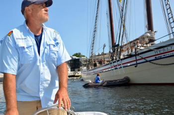 Camden Harbor Master Steve Pixley, moving the Schooner Heritage into her temporary berth in Camden’s inner harbor. (Photo by Lynda Clancy)