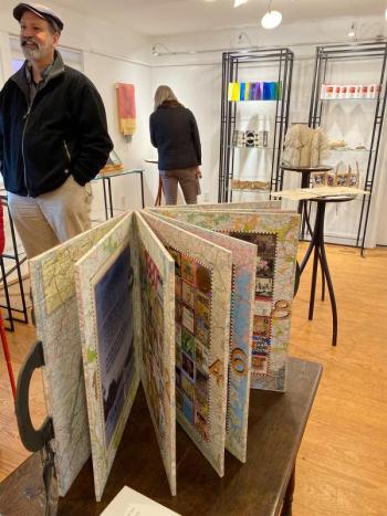 Midcoast Maine Book Arts exhibition, with exhibiting artist Richard Reitz-Smith shown in the foreground. (Photo by Cynthia Motian McGuirl)