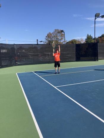 Ronnie Vanesse serves. (Photo courtesy Midcoast Recreation Center)