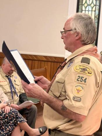 Scoutmaster Bruce Bossow read a congratulatory letter for U.S. Representative Chellie Pingree. (Photo courtesy Chuck Mahaleris)