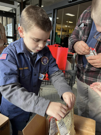 Callum Dorias, of Madison, is a member of Pack 428 in Pittsfield and took part in the Scouting for Food Drive on November 11. (Photo courtesy Chuck Mahaleris)