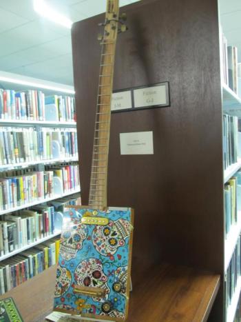 Custom cigar box guitar. Photo by Kay Stephens