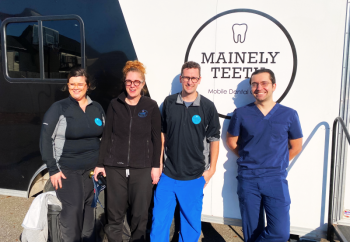 Left to right: Danielle Marshall, Dental Assistant at Mainely Teeth; Amber Lombardi -founder and president of Mainely Teeth; Michael Lombardi - co-founder of Mainely Teeth; and Dr. Robert Grassi, dentist at Knox County Dental Clinic. (Photo courtesy Knox County Homeless Coalition)