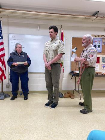 Karen Norton, of Harpswell, and Mike Labbe, of Topsham, honored Troop 200 Committee member Jared Todd for completing all requirements for the Wood Badge leadership course he began in September of 2021 during a ceremony held at the First Congregational Church in Camden on October 30. (Photo courtesy Chuck Mahaleris)