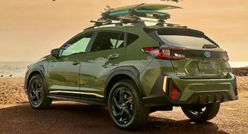 For 2024, the Crosstrek has been redesigned. The Sport model sits 8.7 inches high on 18-inch alloy wheels with all-terrain tires. Alpine Green is one of the hot colors this year, and the Sport trim gets yellow and black accents and special badges. The roof rack is an available option.