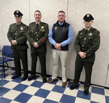 Pictured after recently graduating from the Maine Criminal Justice Academy are Callahan Crosby (left) and August Campbell (right) with Marine Patrol Colonel Matthew Talbot (2nd from left) and Department of Marine Resources Commissioner Patrick Keliher (2nd from right). (Photo courtesy Department of Marine Resources)