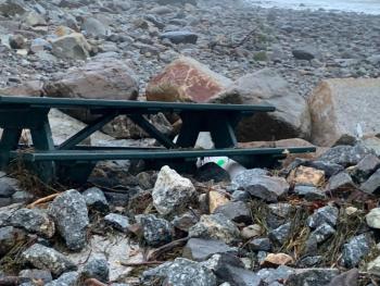 A picnic table has been partially buried in storm rubble at Steamboat Landing in Camden.