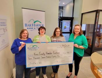 Bar Harbor Bank & Trust (BHBT) presents a donation from the Bank’s Casual for a Cause program to Knox County Homeless Coalition. Pictured from left to right: Hazel Young, AVP Branch Relationship Manager at BHBT; Elizabeth Bengtson, Customer Service Representative at BHBT; Gabriella Finn, Customer Service Representative at BHBT; and Rebecca Gildred, Chief Development Officer at Knox County Homeless Coalition. (Photo courtesy Bar Harbor Bank & Trust)