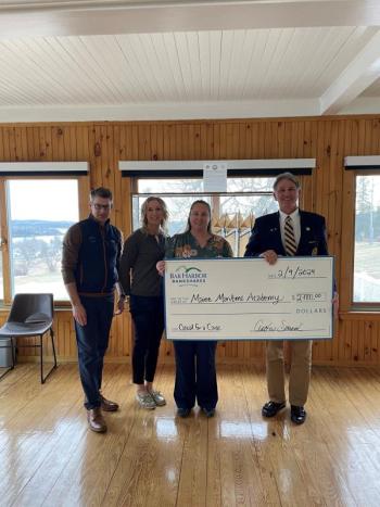 Bar Harbor Bank & Trust (BHBT) presents a donation from the Bank’s Casual for a Cause program to Maine Maritime Academy. Pictured from left to right: Jack Frost, VP Director of Community Giving at BHBT; Crystal Richard, VP Regional Relationship Manager at BHBT; Rebecca Emerson, VP Branch Relationship Manager at BHBT; and Jerald Paul, President of Maine Maritime Academy. (Photo courtesy Bar Harbor Bank & Trust)