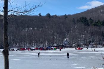Looking across the ice toward the chute from Hosmer Pond Road.