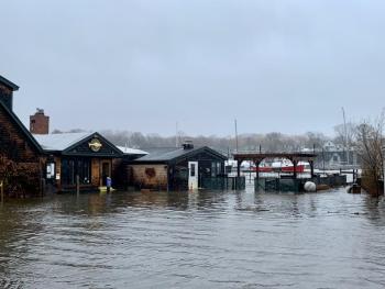The ocean rose again to wash over seawalls and flood buildings along Bay View Street, in Camden, March 10, 2024.