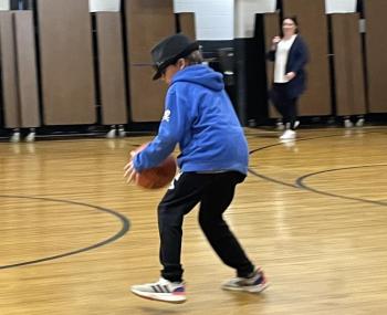 4th grader Ben Brown dribbles down the court in a relay race. (Photo courtesy Thomaston Grammar School)