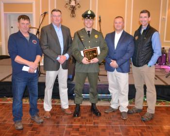 Maine Marine Patrol Officer Alex Michaud (center) receives the 2024 Maine Lobstermen’s Association Officer of the Year Award during the Fishermen’s Forum. Pictured with Officer Michaud are Cutler lobsterman and MLA Board President Kristan Porter (left), Department of Marine Resources Commissioner Patrick Keliher (2nd from left), Sergeant Matthew Wyman (2nd from right) and Major Rob Beal (right). (Photo courtesy Maine Dept. of Marine Resources)