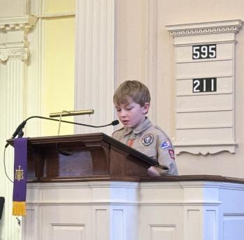 Zavier Mason Scout rank and he is reading the 23rd Psalm. (Photo courtesy Chuck Mahaleris)