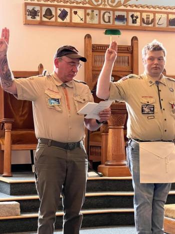 Troop 200 Scoutmaster Ed Weber leads James in the Eagle Scout Charge during James' Eagle Scout ceremony. (Photo courtesy Chuck Mahaleris)