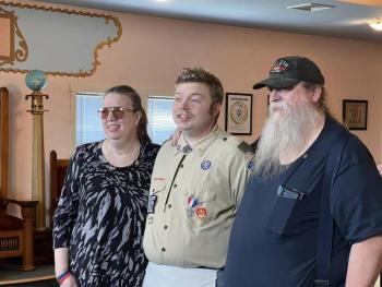 James with his parents, Linda and Kenneth. (Photo courtesy Chuck Mahaleris)