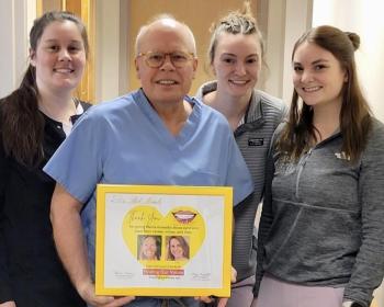 Dr. Rob Berube of Facial & Oral Surgery in Augusta with nurses (l-r): Makenzie Hays, MaryAnn McGrath, and Abigail Wright, posing with their "Finding Our Smiles" appreciation plaque. (Photo supplied by Dr. Berube)