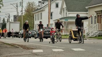 Adults and children ride toward South Elementary School, in Rockland, during May 17’s Rockland’s Bike to Work (+ School!) Day. (Photo courtesy David Troup)