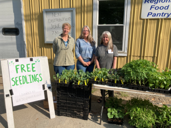 Master Gardener Volunteers Linda, Patty, and Mary distributing seedlings at the Volunteer Regional Food Pantry in Unity. (Photo courtesy Waldo County Bounty)