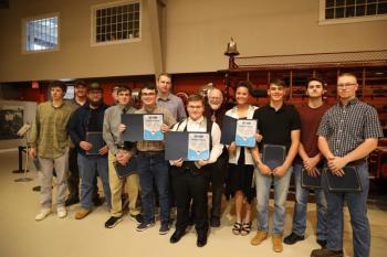 Machine Tool Program (left to right, Emmett Dorr, Rob Greely (volunteer), Ian Wade, Peter Simmons, Dan Bartlett, Griffin Shortall, Ethan Butler, Dagen Campbell, Rich Barratt (teacher), Caitlin Lamb, Sullivan Bartlett, Ryan Seeber, Jonathan Brown. (Photo courtesy Mid-Coast School of Technology)
