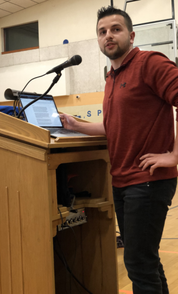 Regional School District 40 Board Member Joshua Blackman, of Warren, speaks the audience at Union Elementary School on May 18. Blackman said his peers in Generation Z are suffering “a mental health crisis related to gender identity.”(Sarah Masters photo)