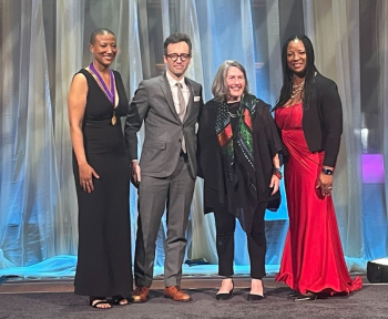 Susan T. Rodriguez (right center) and Timothy Lock (left center) receiving the AIA Architecture Award from AIA President Kimberly Dowdell (left) and AIA CEO Lakisha Woods (right).
(Photo courtesy Anne Hicks Harney)
