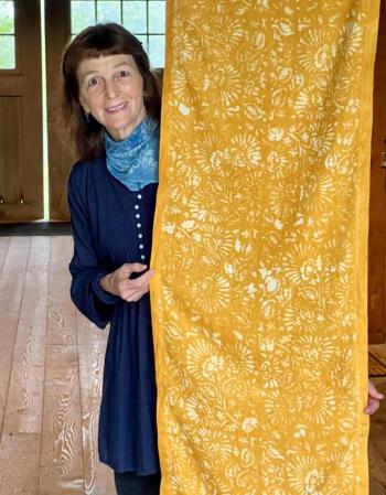 Antonia Munroe with her hand-stenciled linen table runner